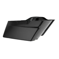 Glossy black motorcycle saddlebag.